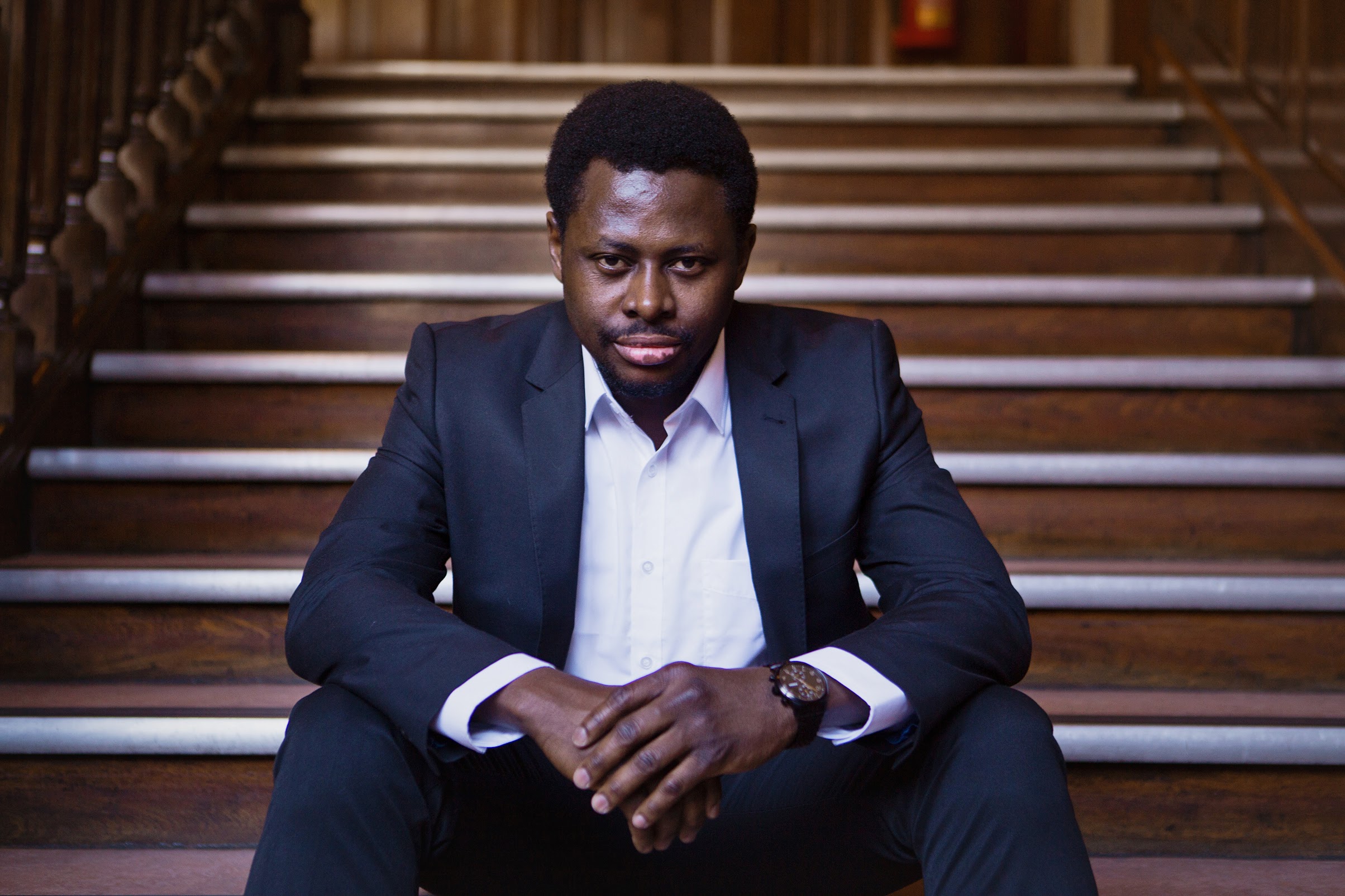 Close up of male sitting on stairs