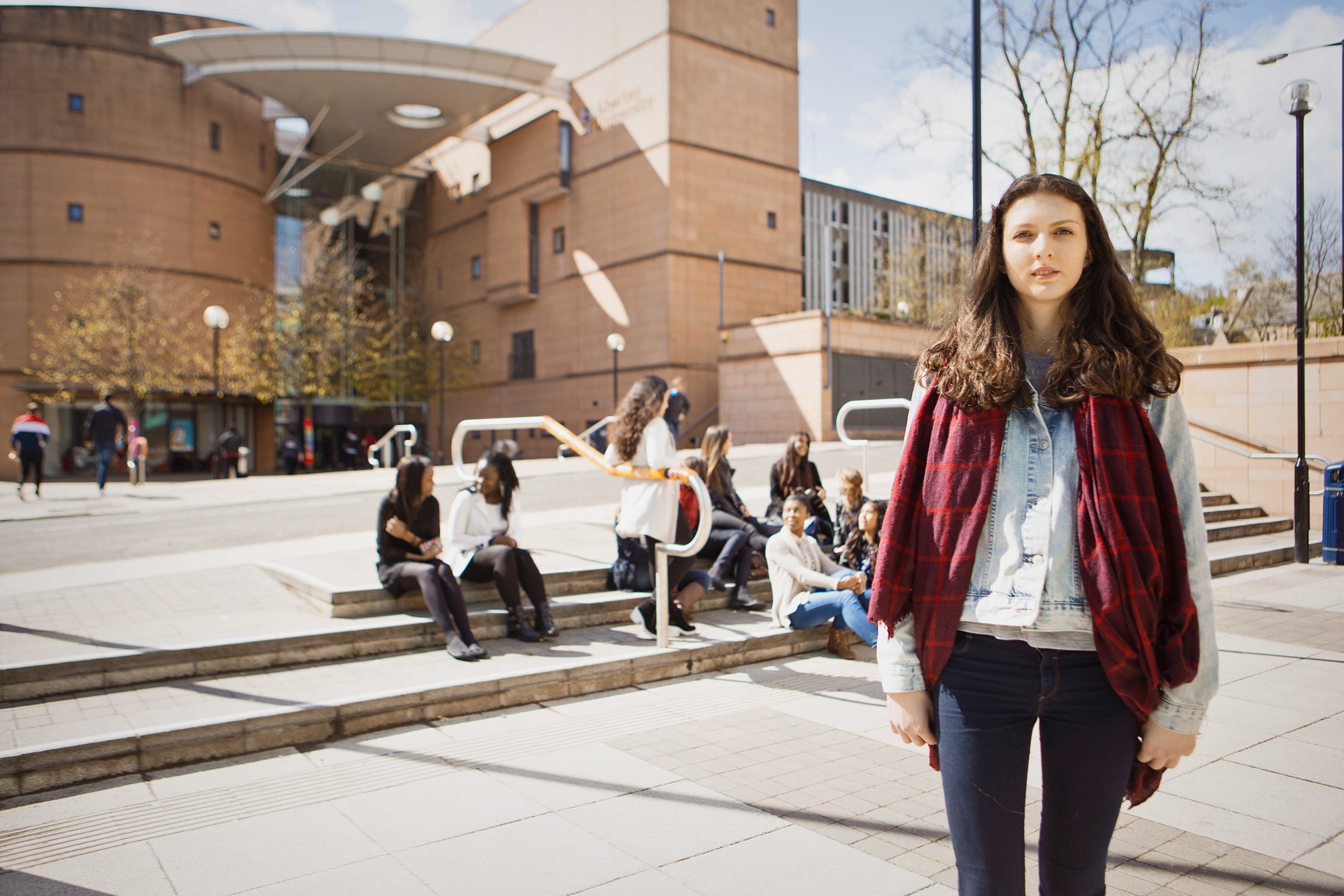 Female standing outside the Bernard King Library