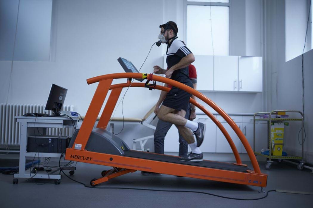 Male running on a running machine whilst wearing breathing apparatus