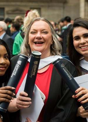 Three Abertay graduates outside the Caird Hall 