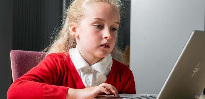 Girl using computer in psychology experiment