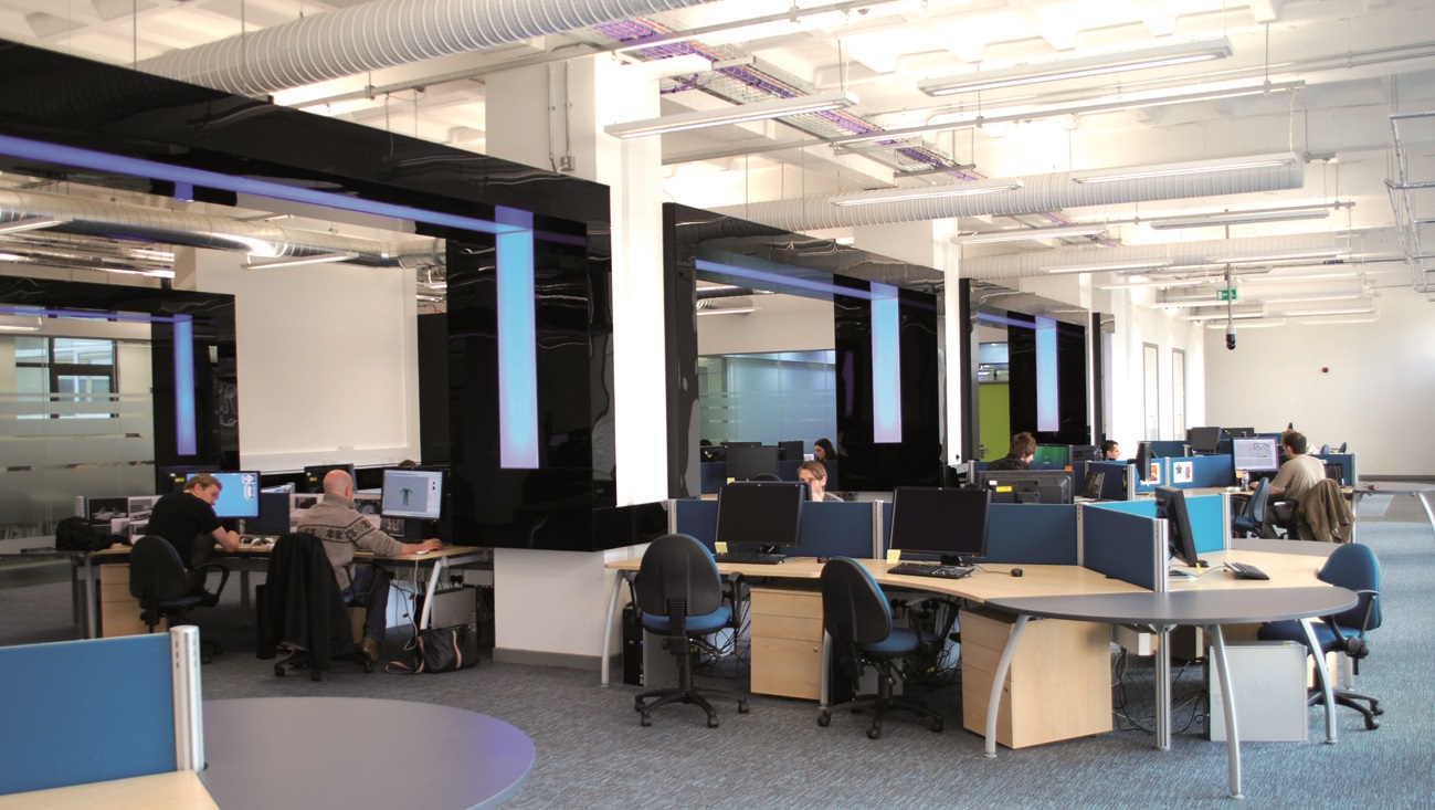 Students sitting at desks using Desktop Computers