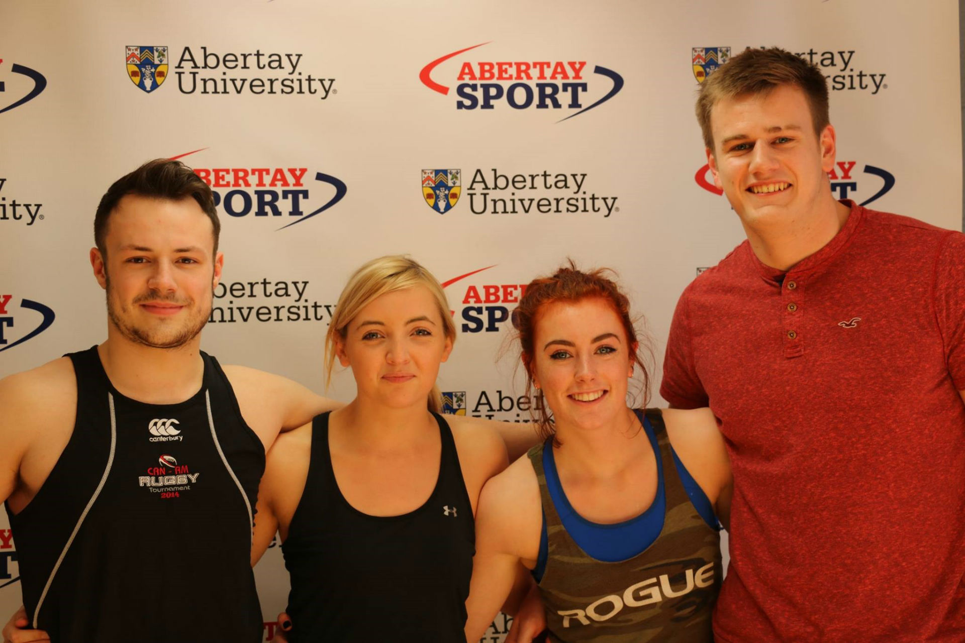 2 males, 2 females wearing sports clothes