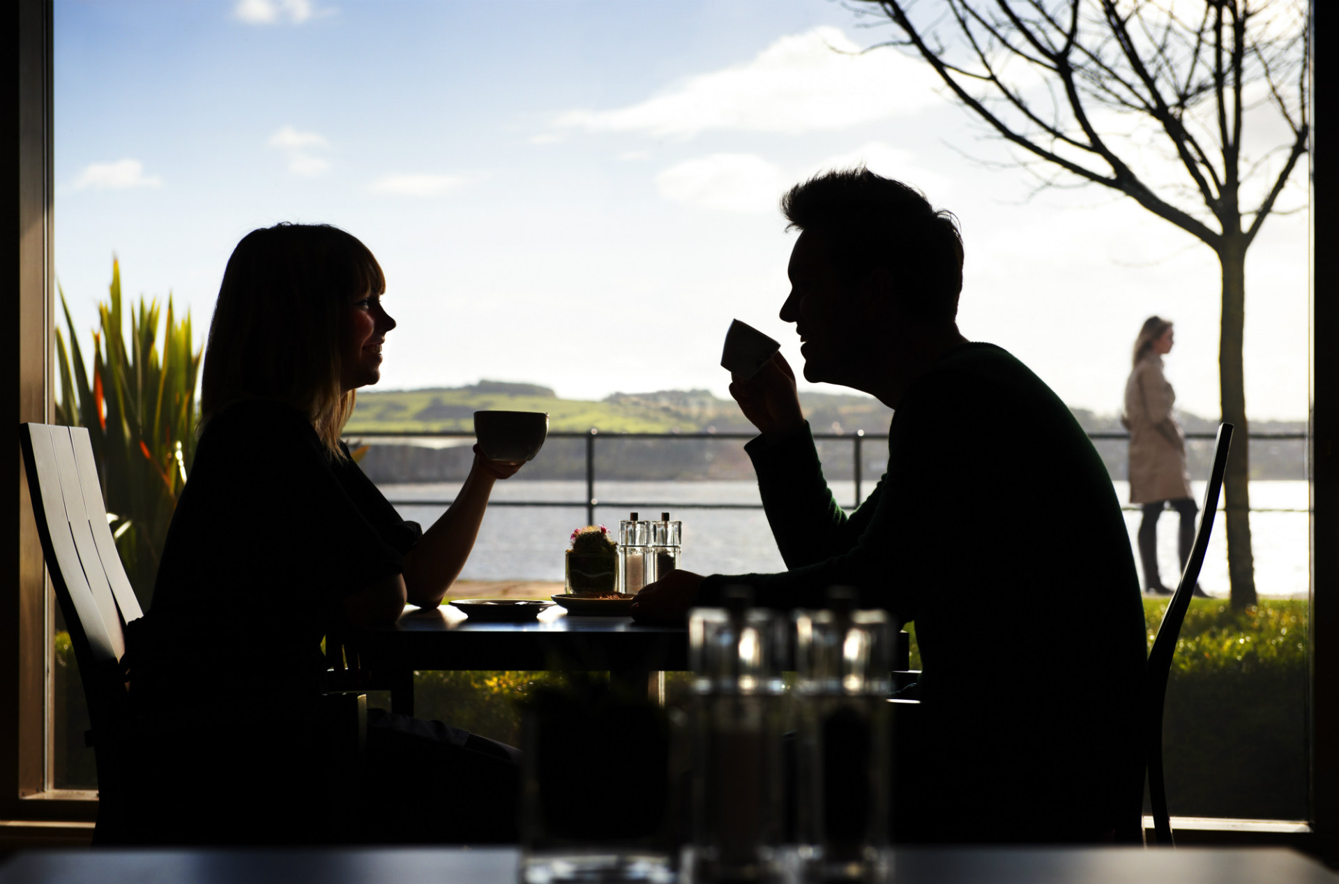 Male and female drinking coffee