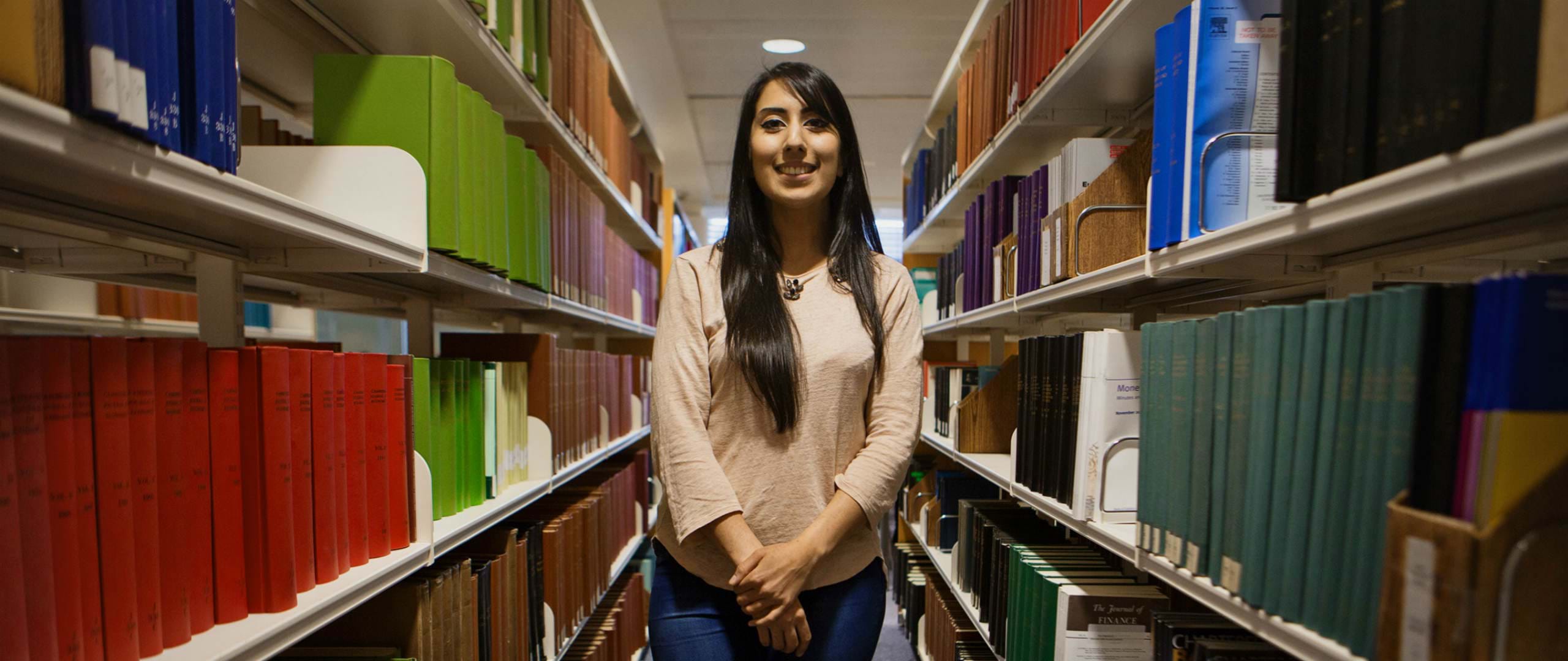Student in the Abertay University library