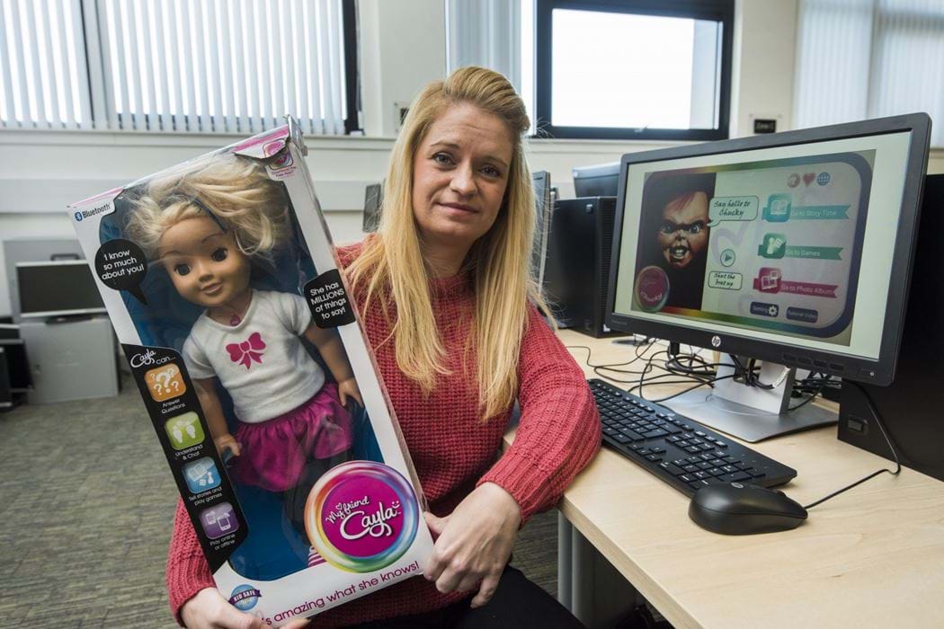 Female Ethical Hacking student Cheryl Torano with a hacked Cayla Doll