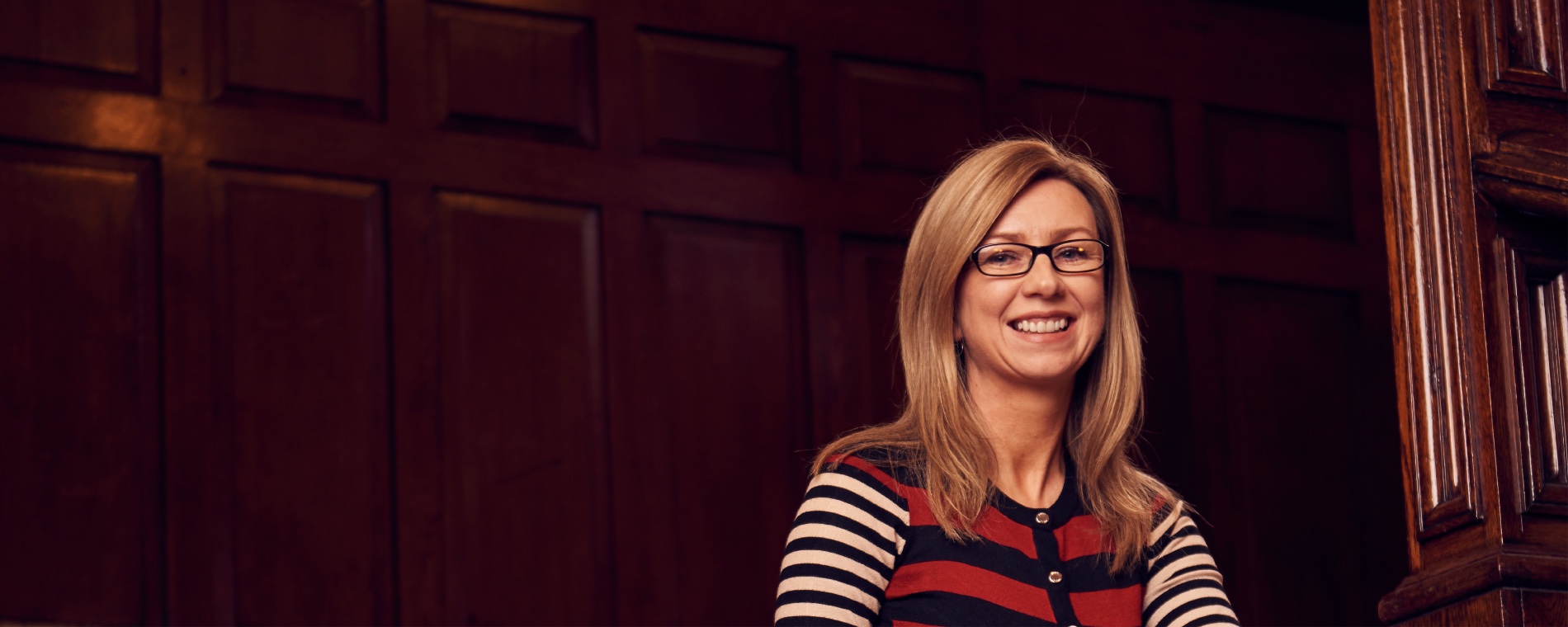 Graduate smiling in Business School