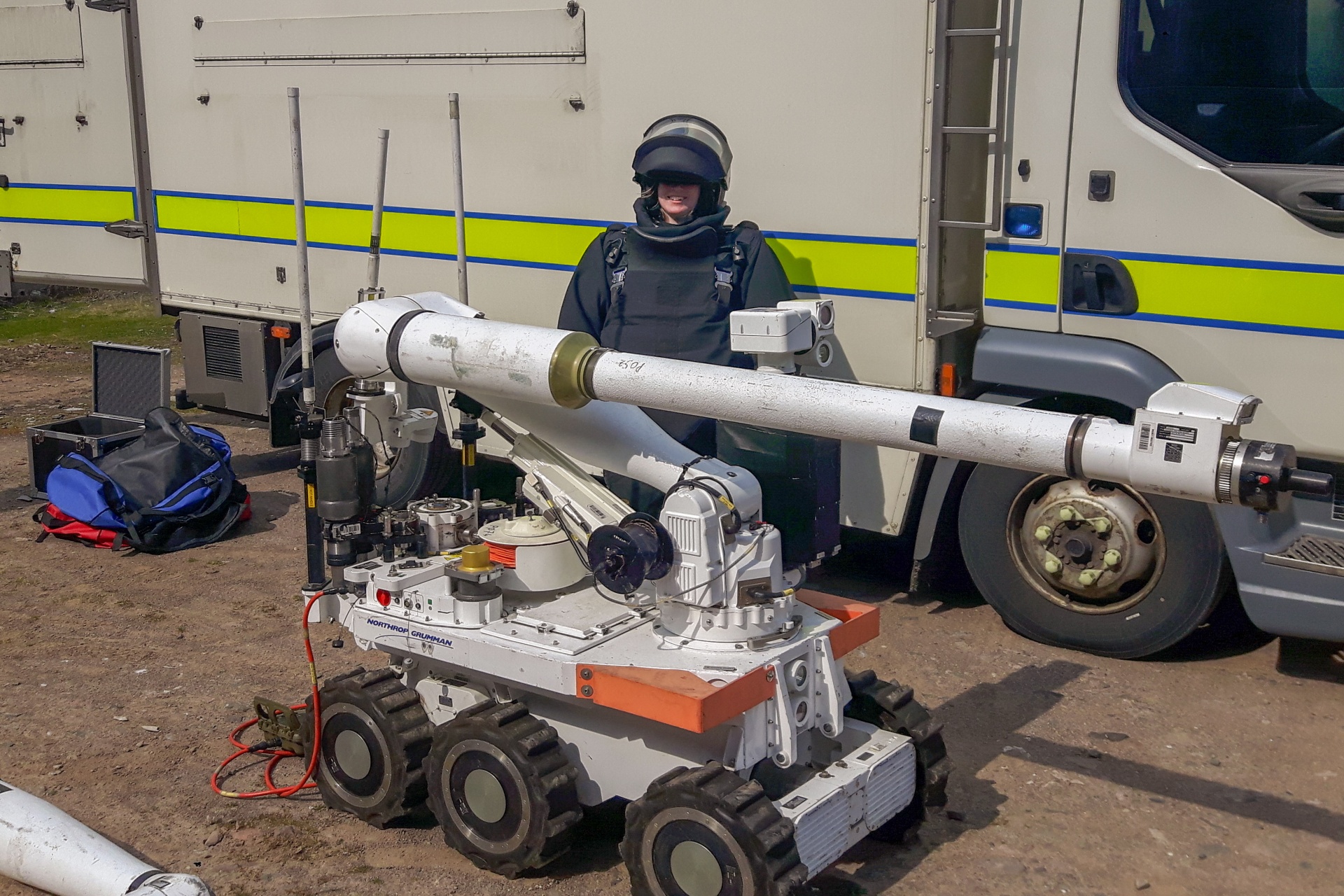 A student tries on a bomb disposal suit