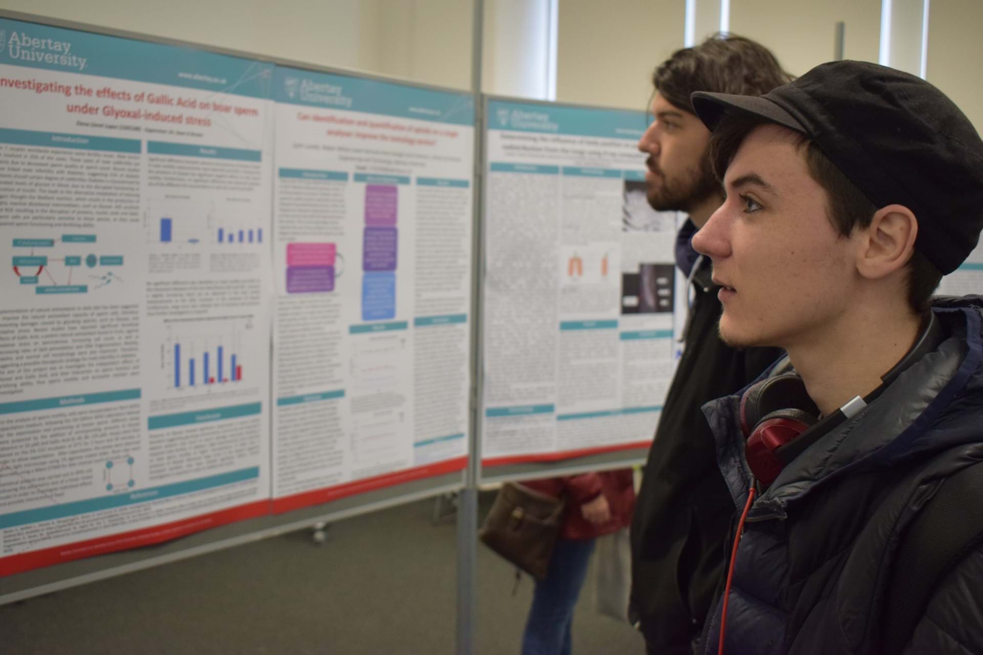 People looking at posters at the Science Degree Day