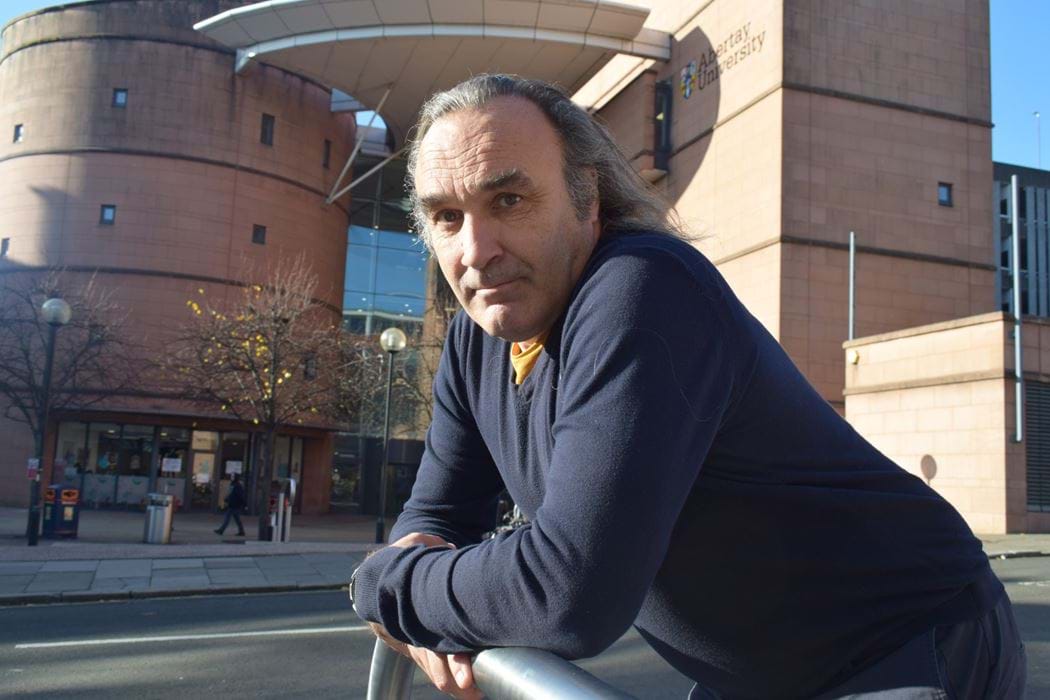 A picture of Dr Andrew Samuel outside Abertay Library