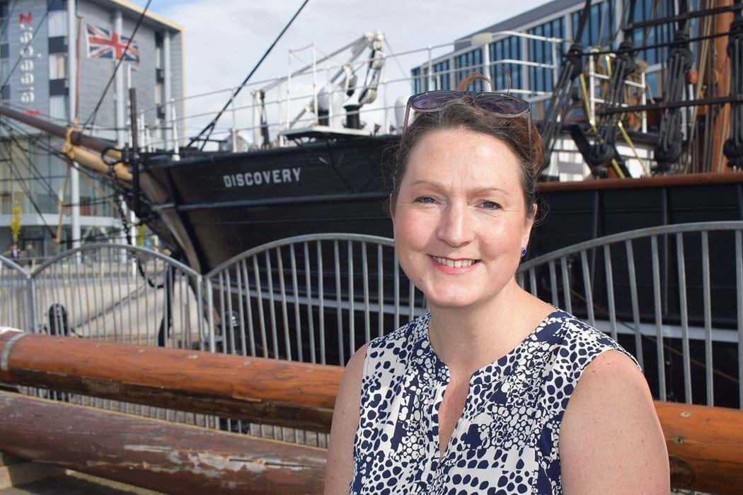 Rebecca Wade, Senior Lecturer Abertay university, stood in front of the RRS Discovery, Dundee. 