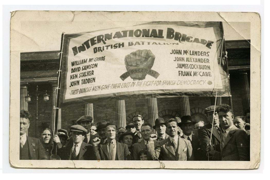 Postcard with image of International Brigade Banner in front of the Caird Hall, Dundee. including name "ken" Stalker, former student of Dundee Technical College (Abertay University) 