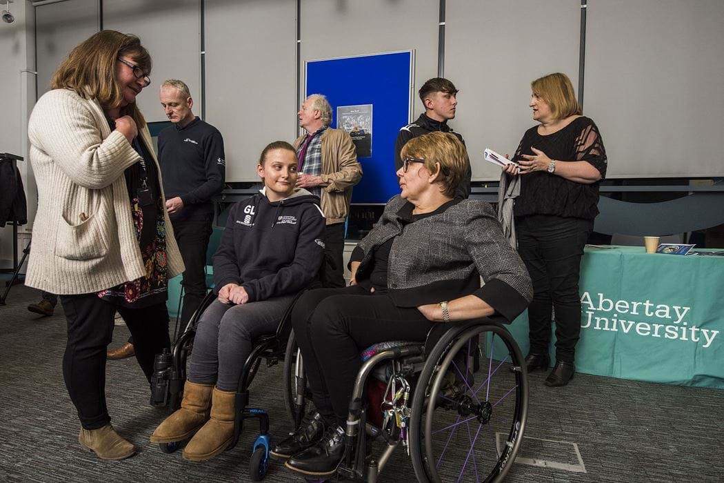 Sport Care Baroness Tanni-Grey Thompson and a student in wheelchairs