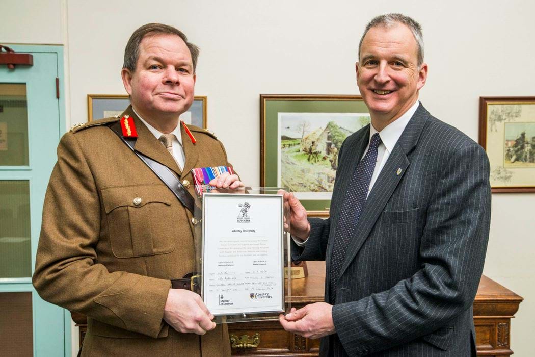 Nigel Seaton and Major General Nick Ashmore holding Signed Armed Forces Covenant Final