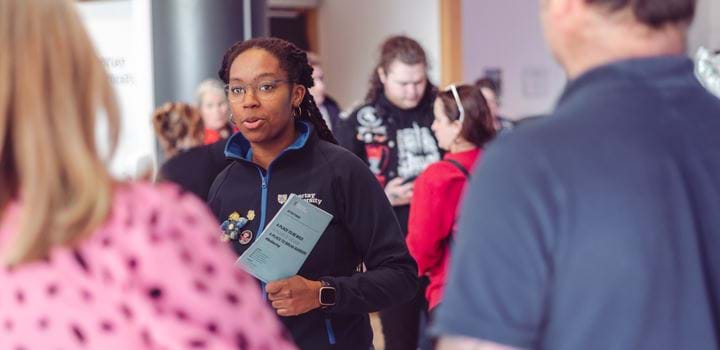 An ABertay Student Ambassador welcoming guests to the university.