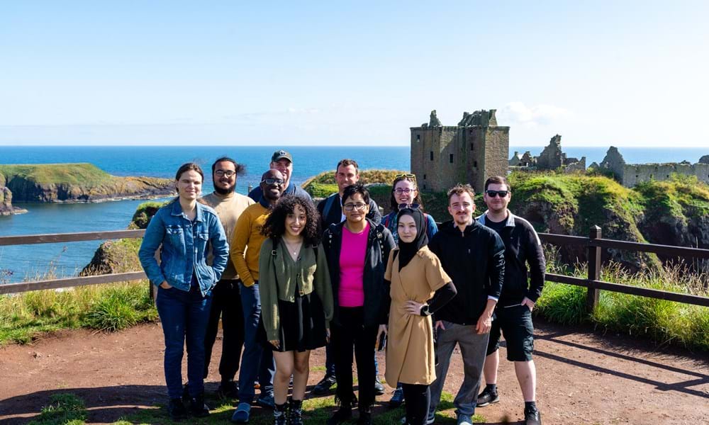 NOVA students standing in front of Dunnotar Castle, Scotland